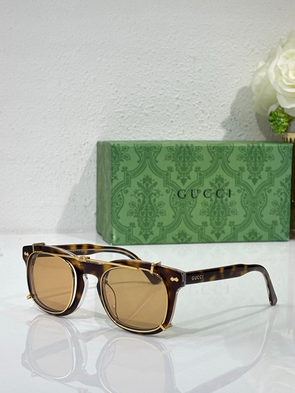 Round sunglasses with tortoiseshell-style frames and tan-tinted lenses