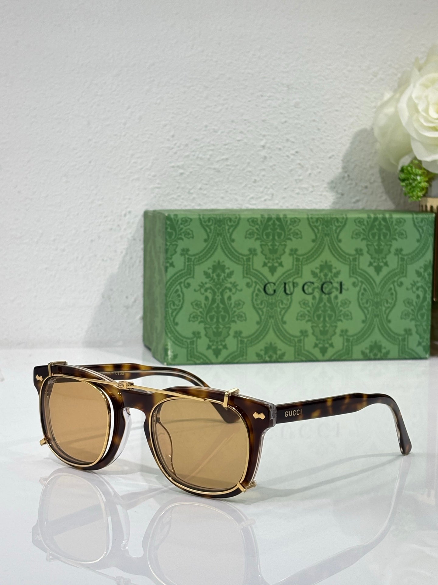 Round sunglasses with tortoiseshell-style frames and tan-tinted lenses