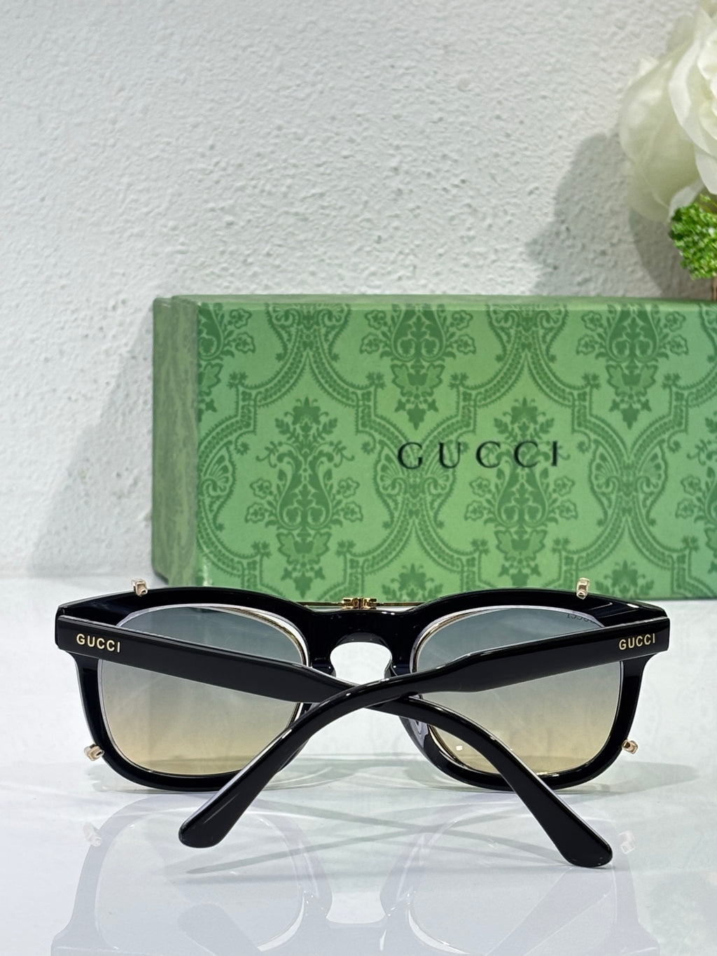 Cat-eye sunglasses with black frame and mirrored lenses