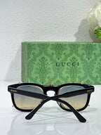 Cat-eye sunglasses with black frame and mirrored lenses