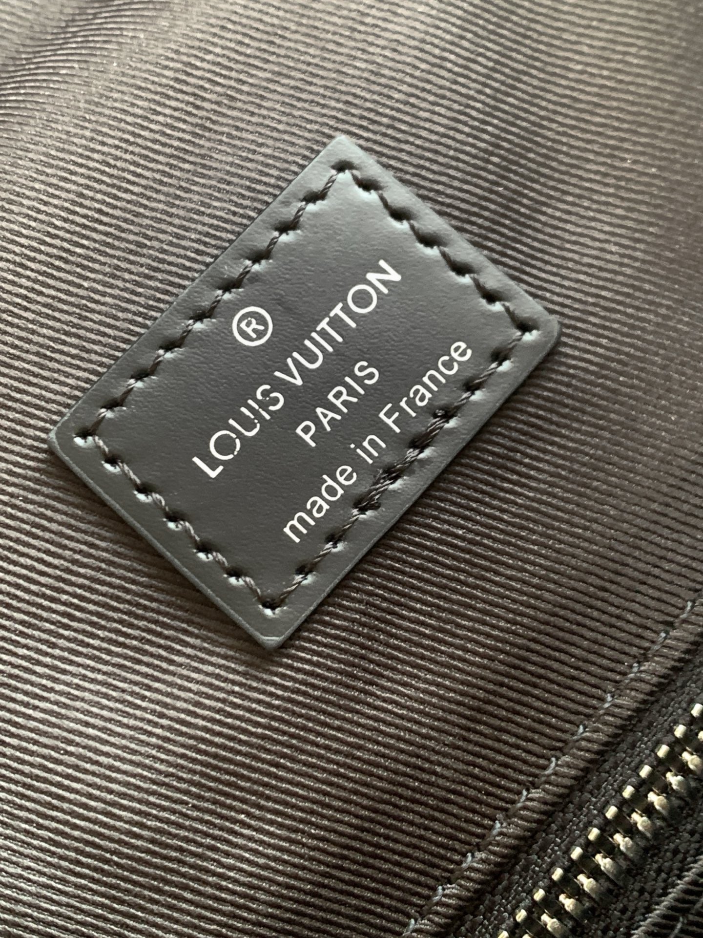 Men's Louis Vuitton fabric logo patch with “Louis Vuitton Paris” and “made in France”