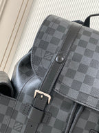 Men's Louis Vuitton checkered bag close-up with leather trim and magnetic snap tab