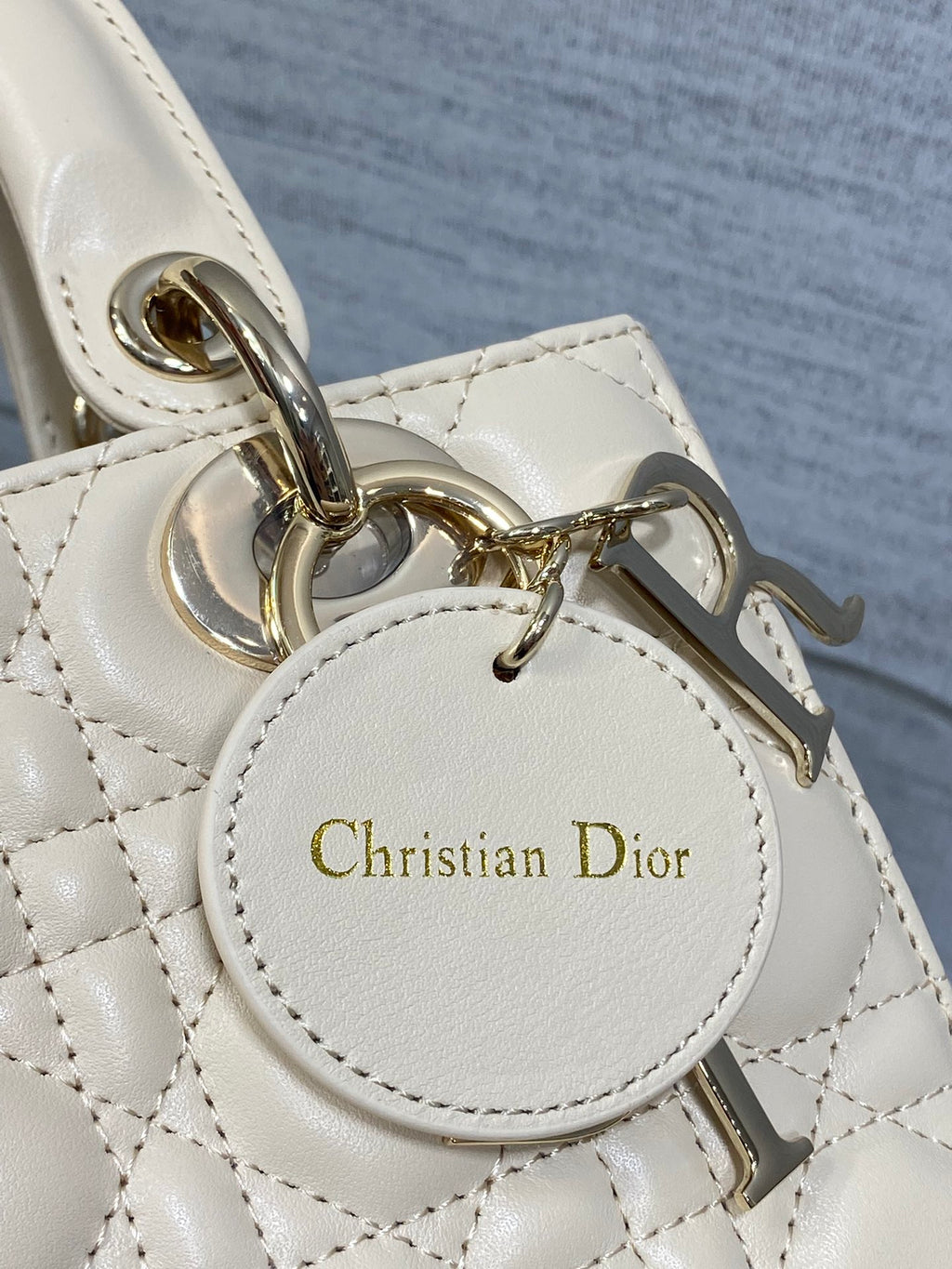 Christian Dior charm tag on silver-tone hardware for quilted handbag