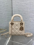 Light beige quilted Dior handbag, gold-tone hardware, top handles and chain strap