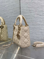 Light beige quilted Dior mini handbag with top handle and side chain strap