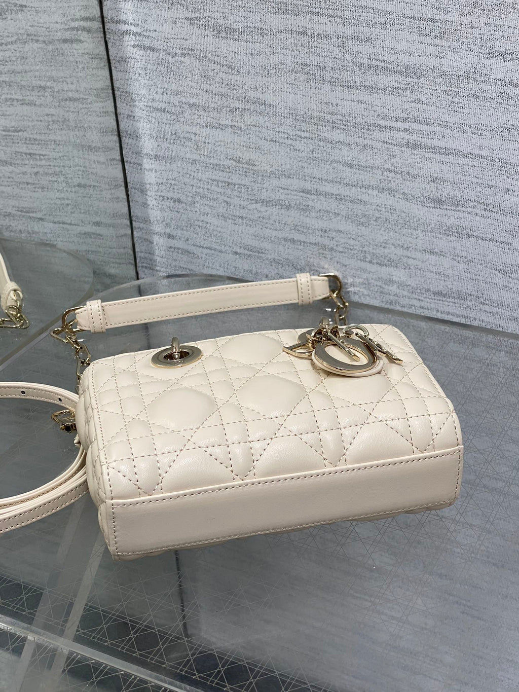 Cream quilted Dior shoulder bag with chain strap and oval logo hardware