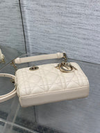 Cream quilted Dior shoulder bag with chain strap and oval logo hardware