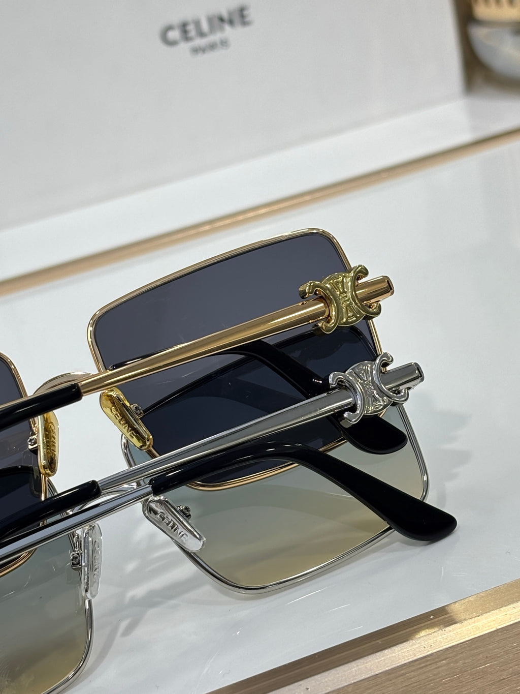 Celine sunglasses close-up of gold hinge detail and tinted lenses