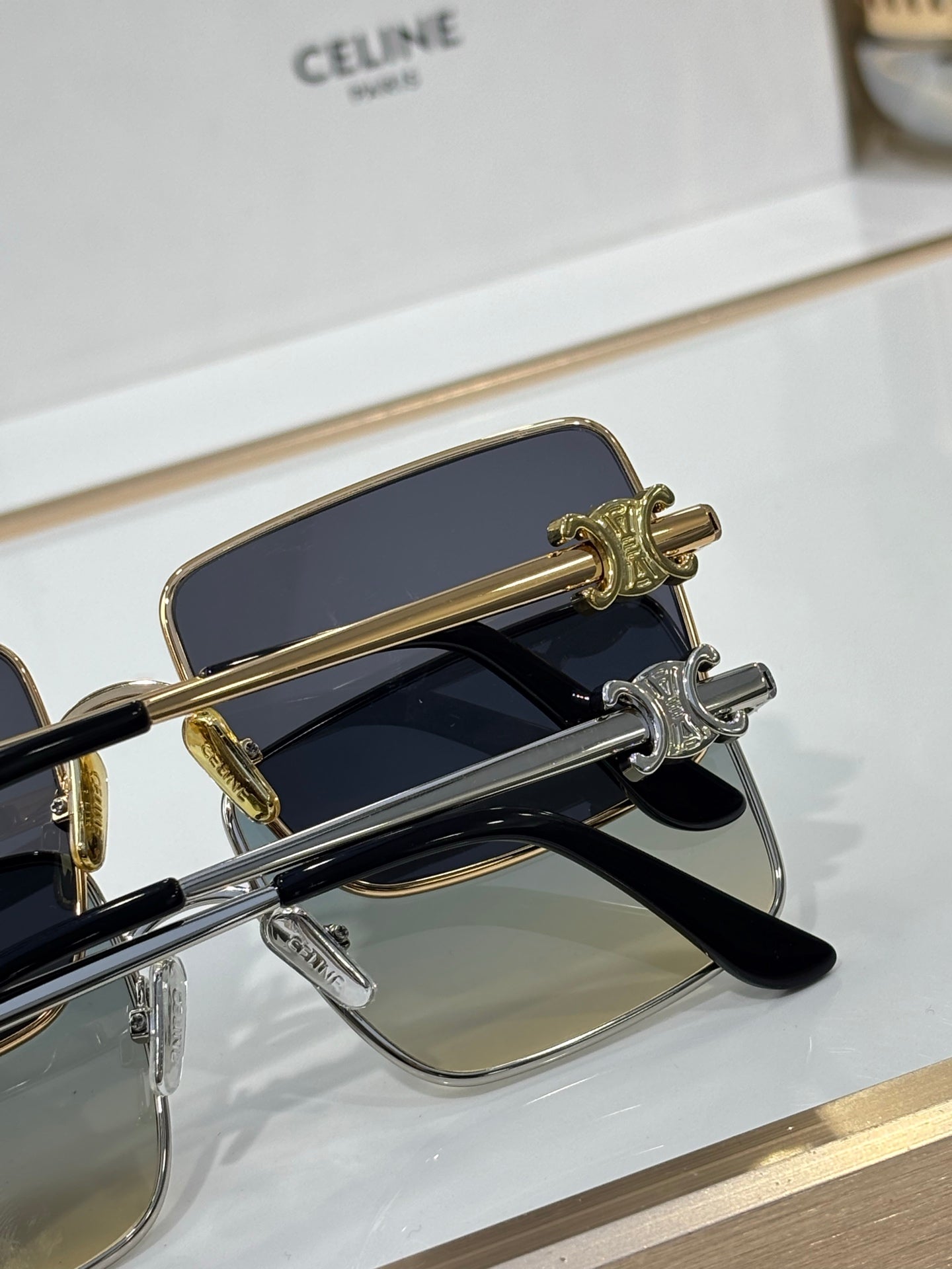 Celine sunglasses close-up of gold hinge detail and tinted lenses