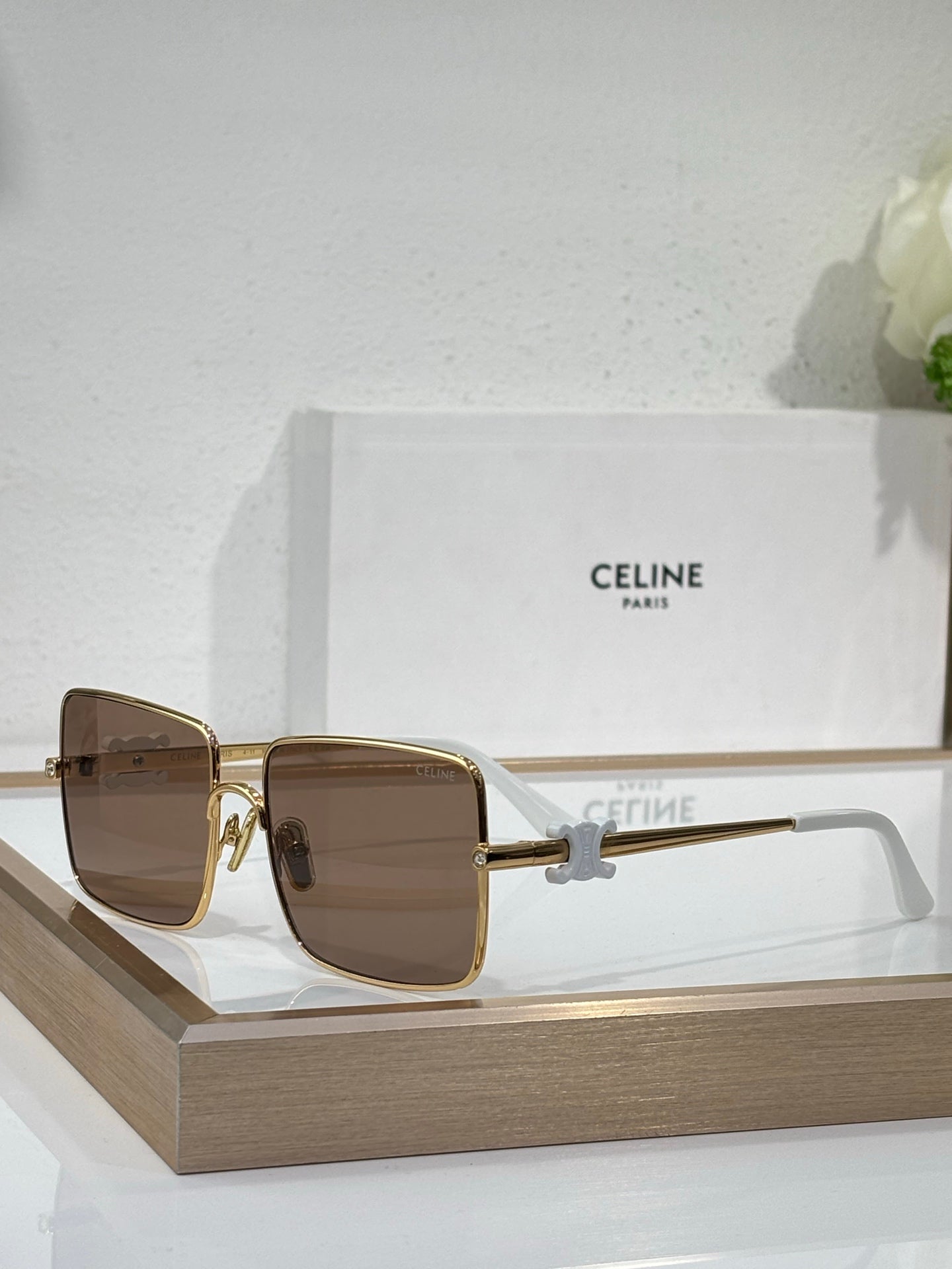 Celine sunglasses with gold frame and warm brown square lenses