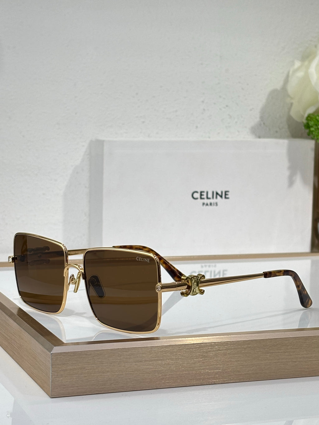 Celine sunglasses with gold frame and brown-tinted square lenses