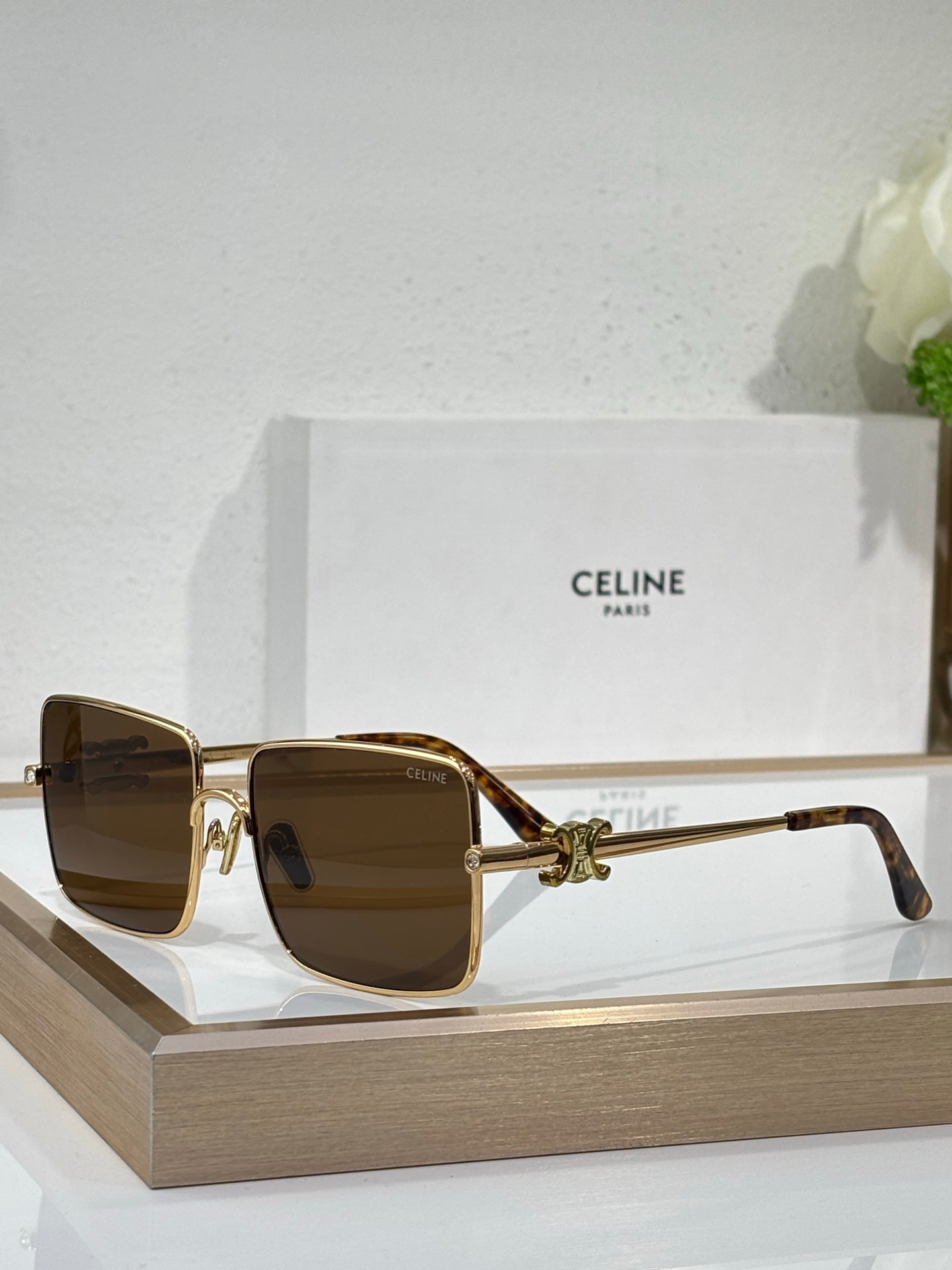 Celine sunglasses with gold frame and brown-tinted square lenses