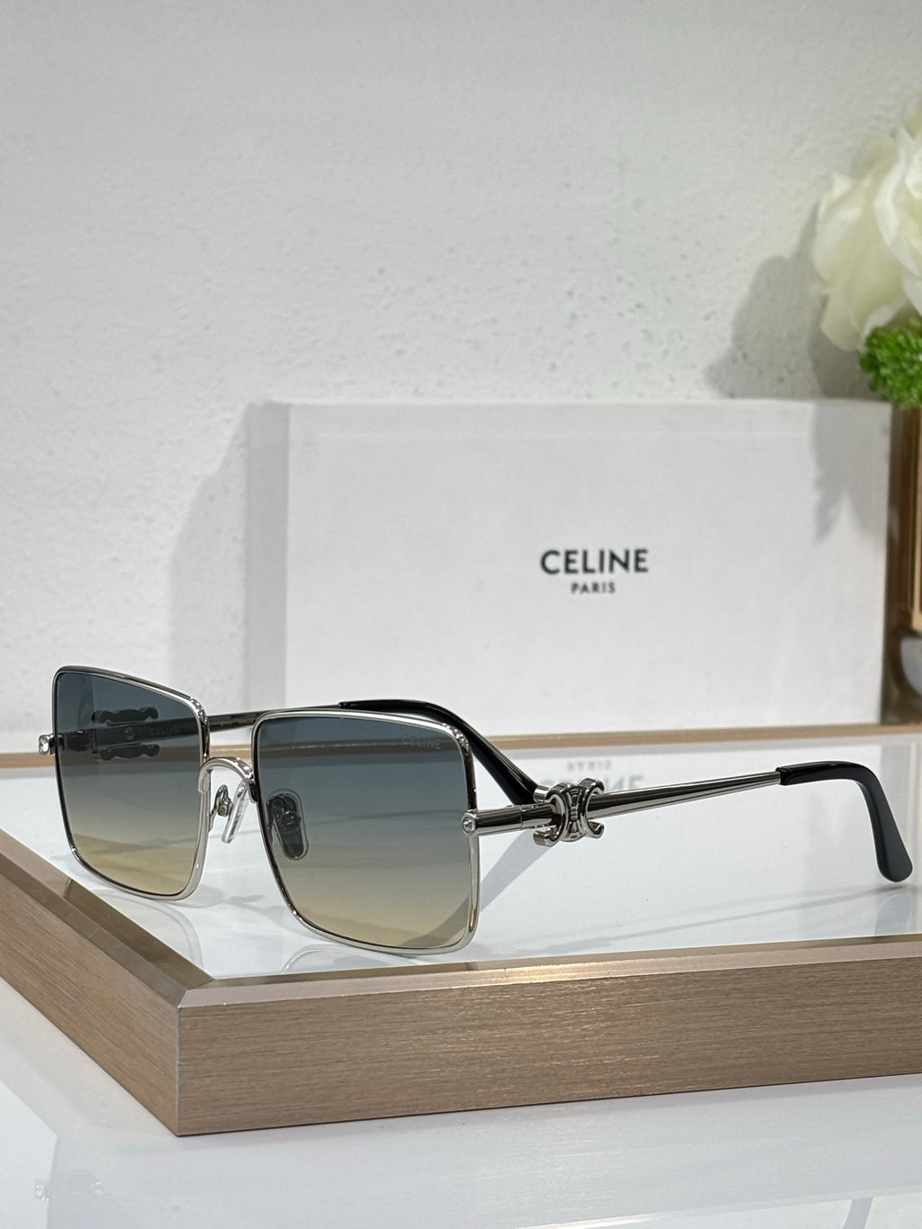 Celine sunglasses with silver-toned frame and dark gradient square lenses