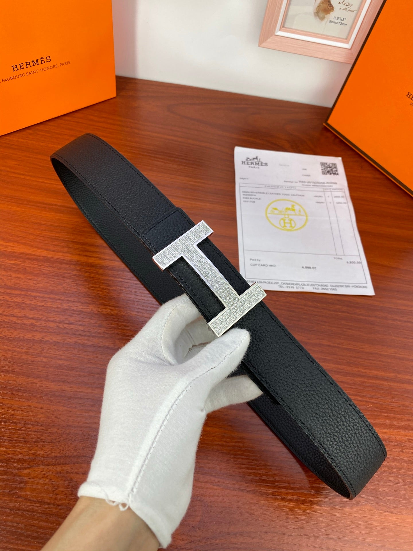 Hermes belt with black textured leather strap and silver-tone H buckle