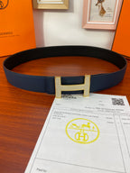 Hermes reversible leather belt with dark blue strap and silver H buckle
