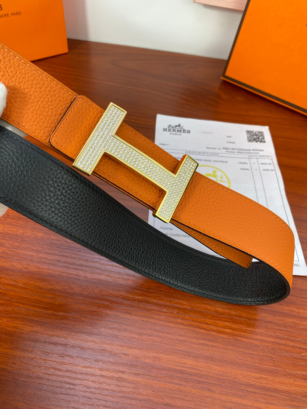 Reversible leather belt: black side with silver-toned studded H buckle