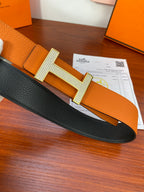 Reversible leather belt: black side with silver-toned studded H buckle