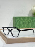 Gucci eyeglasses with black rectangular frames and clear lenses