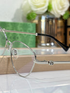 Gucci round eyeglasses with clear lenses and thin metal rim, black temple