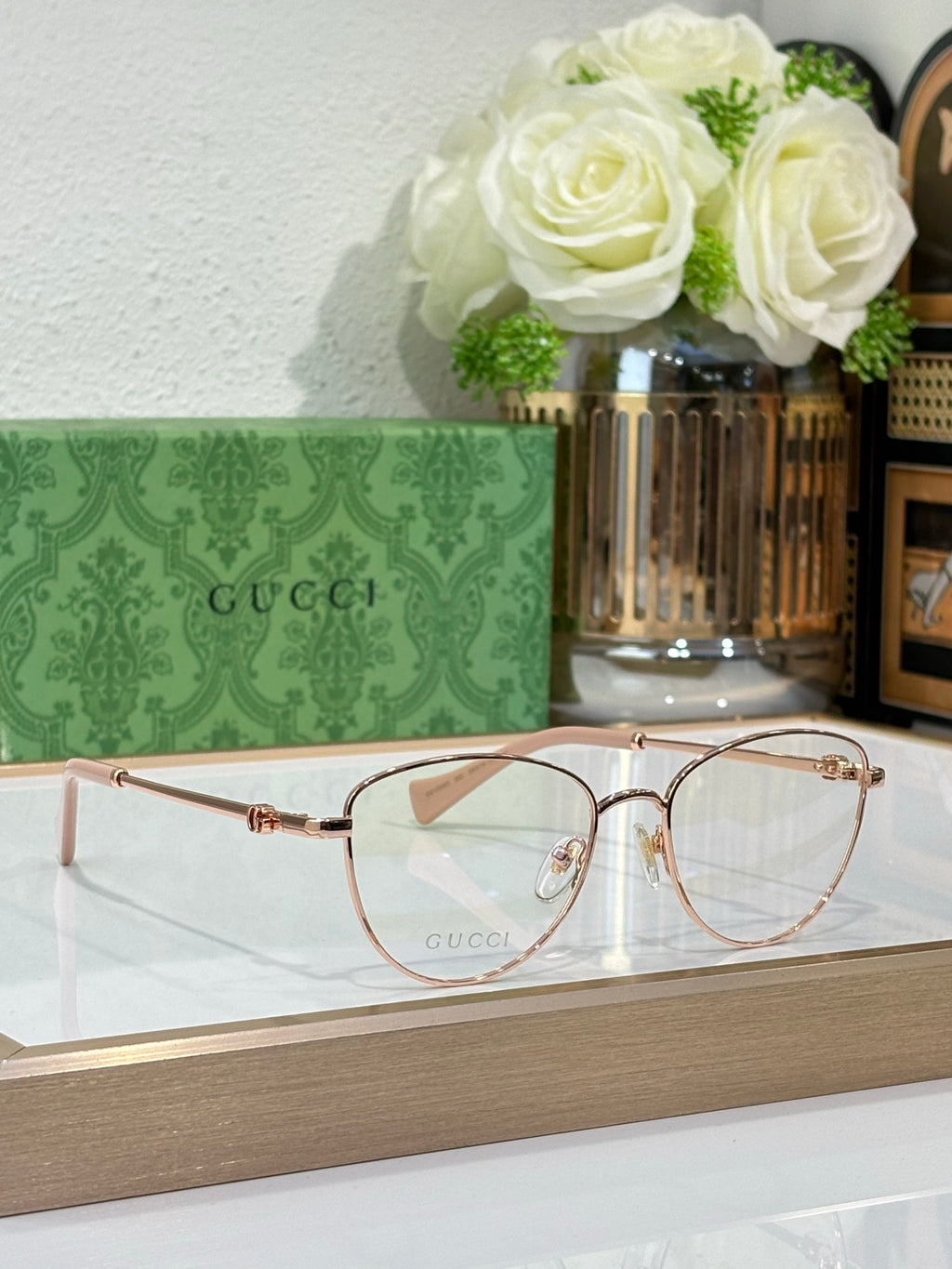 Gucci round eyeglasses with rose-gold frame and clear lenses