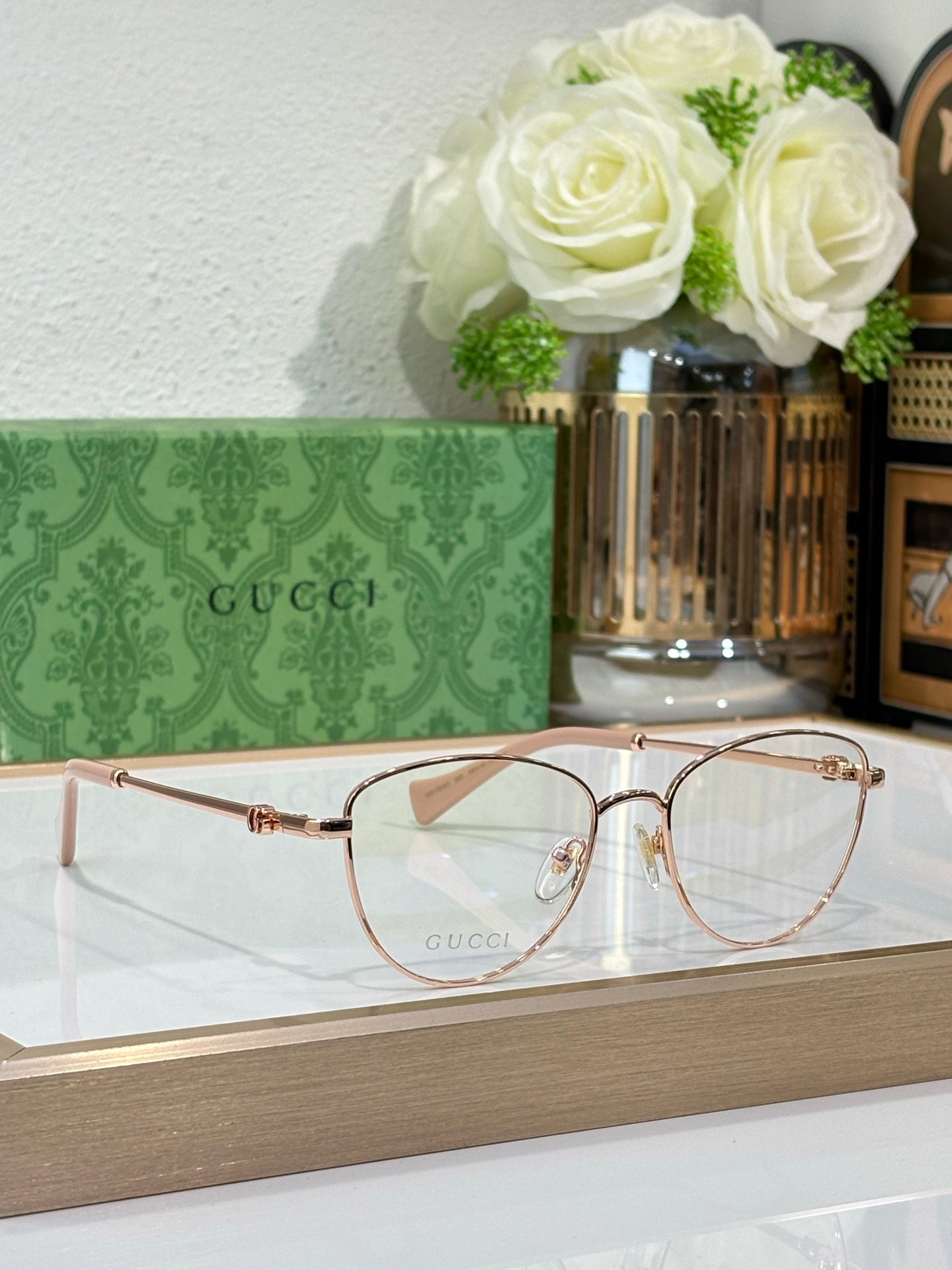 Gucci round eyeglasses with rose-gold frame and clear lenses