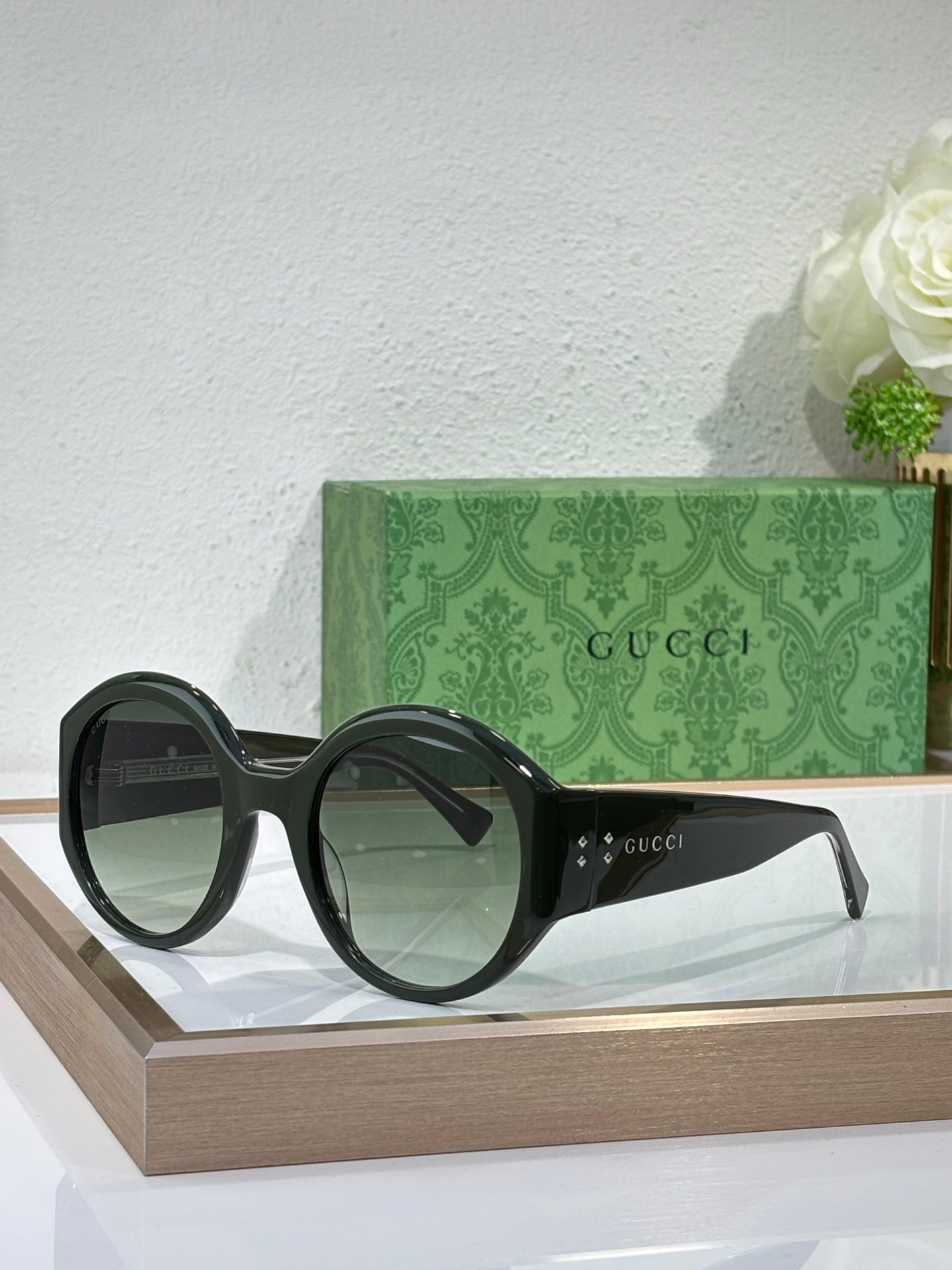 Black oversized round sunglasses with Gucci branding on the arms