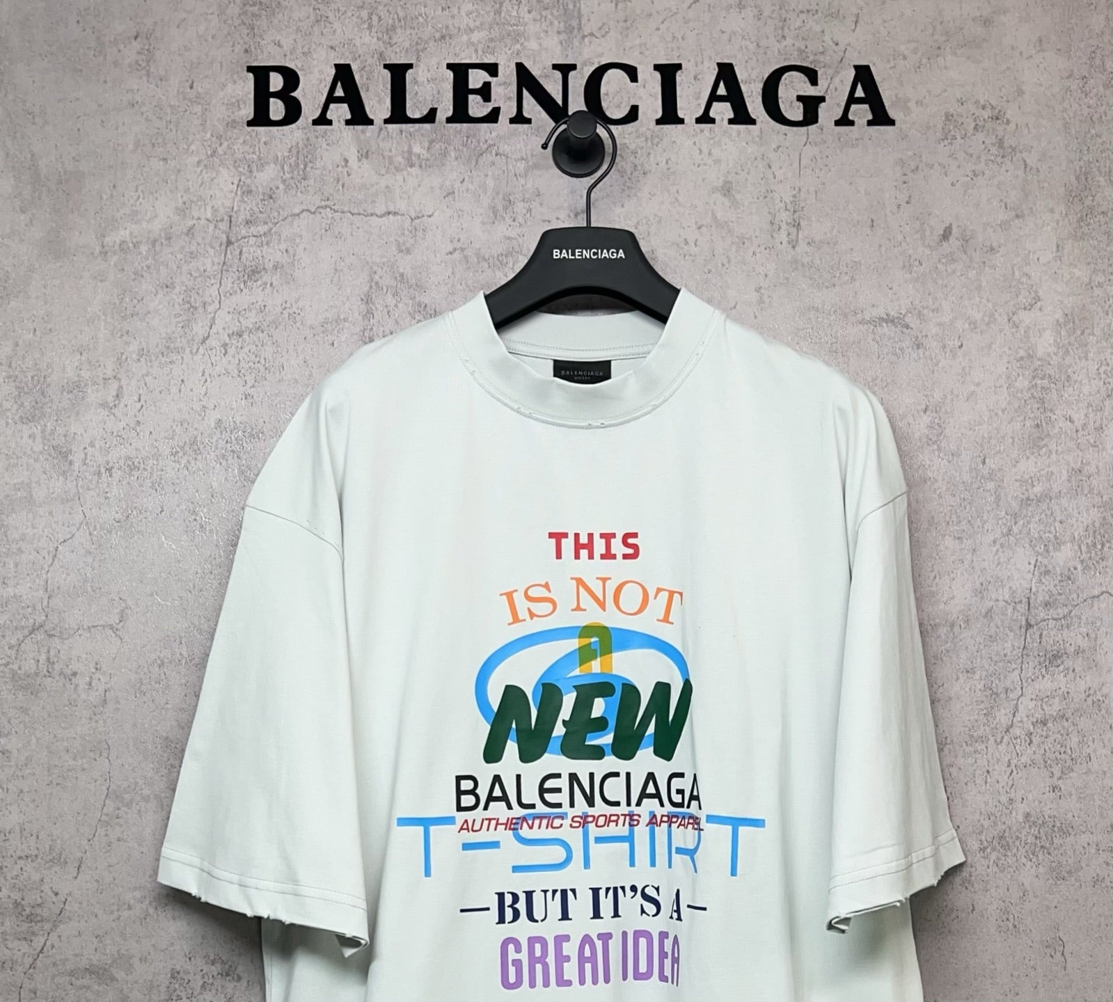 Balenciaga white T-shirt with front “THIS IS NOT NEW” multicolor graphic print