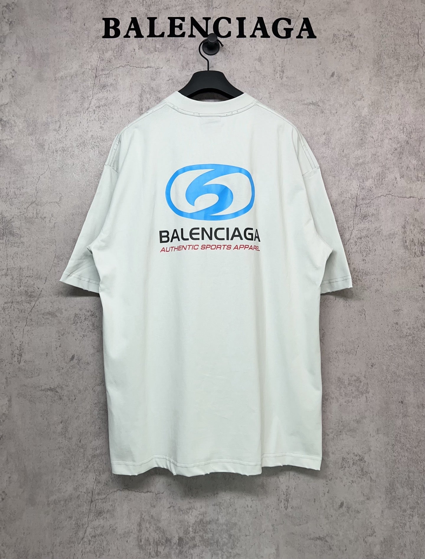 Balenciaga white T-shirt with back “6” logo and “Authentic sports apparel” text