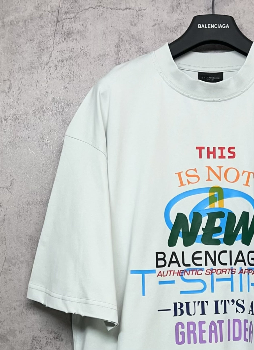 Balenciaga white T-shirt with front “THIS IS NOT NEW” multicolor logo graphic