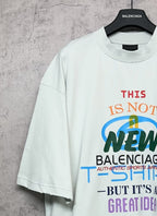 Balenciaga white T-shirt with front “THIS IS NOT NEW” multicolor logo graphic