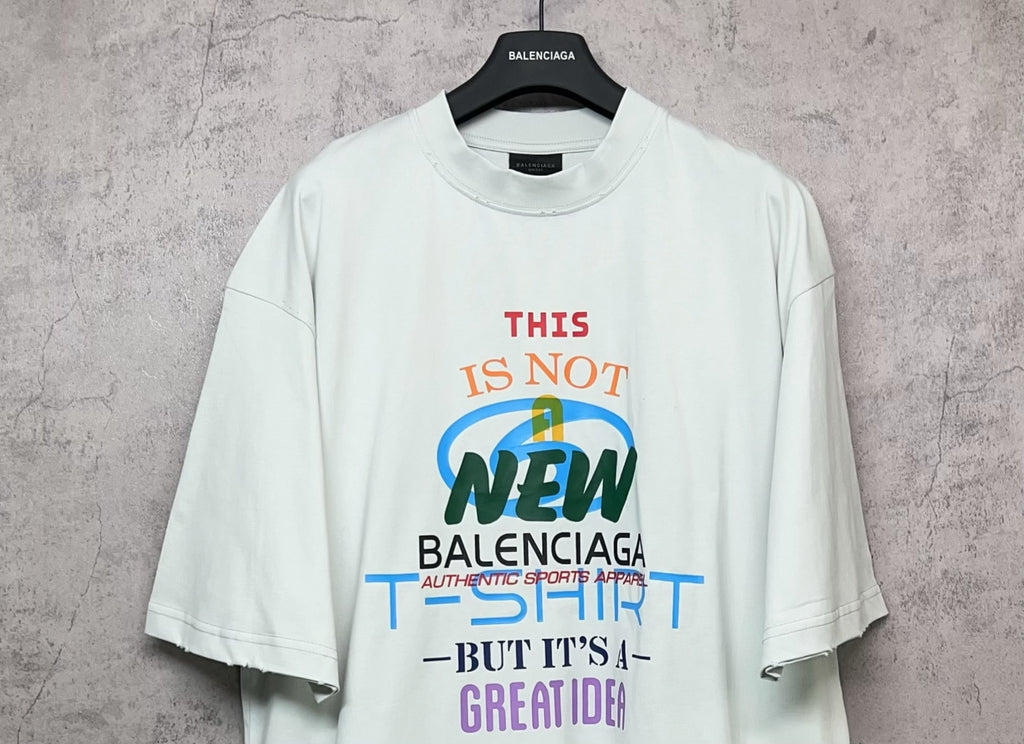 Balenciaga white T-shirt with front “THIS IS NOT NEW” and Balenciaga logo text