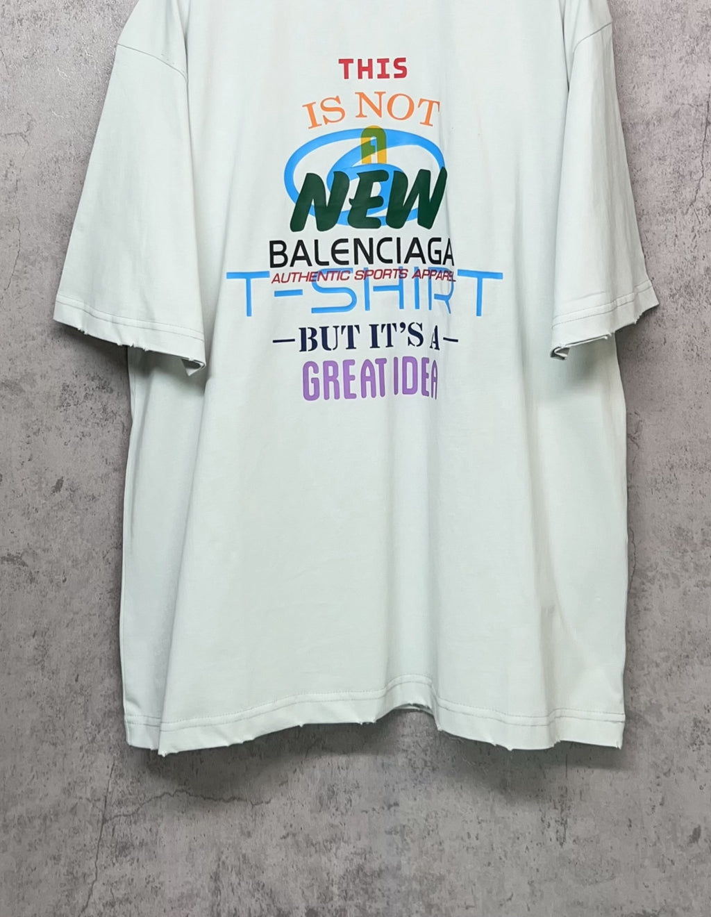 Balenciaga white T-shirt with front graphic “NEW” and stacked slogan print