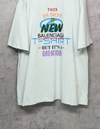 Balenciaga white T-shirt with front graphic “NEW” and stacked slogan print