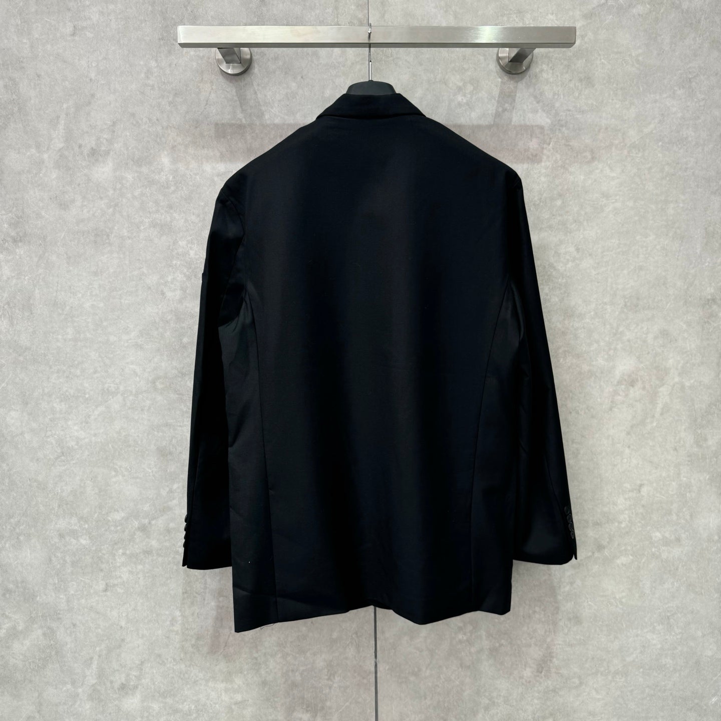 Balenciaga long blazer, dark navy, back view with clean shoulder line