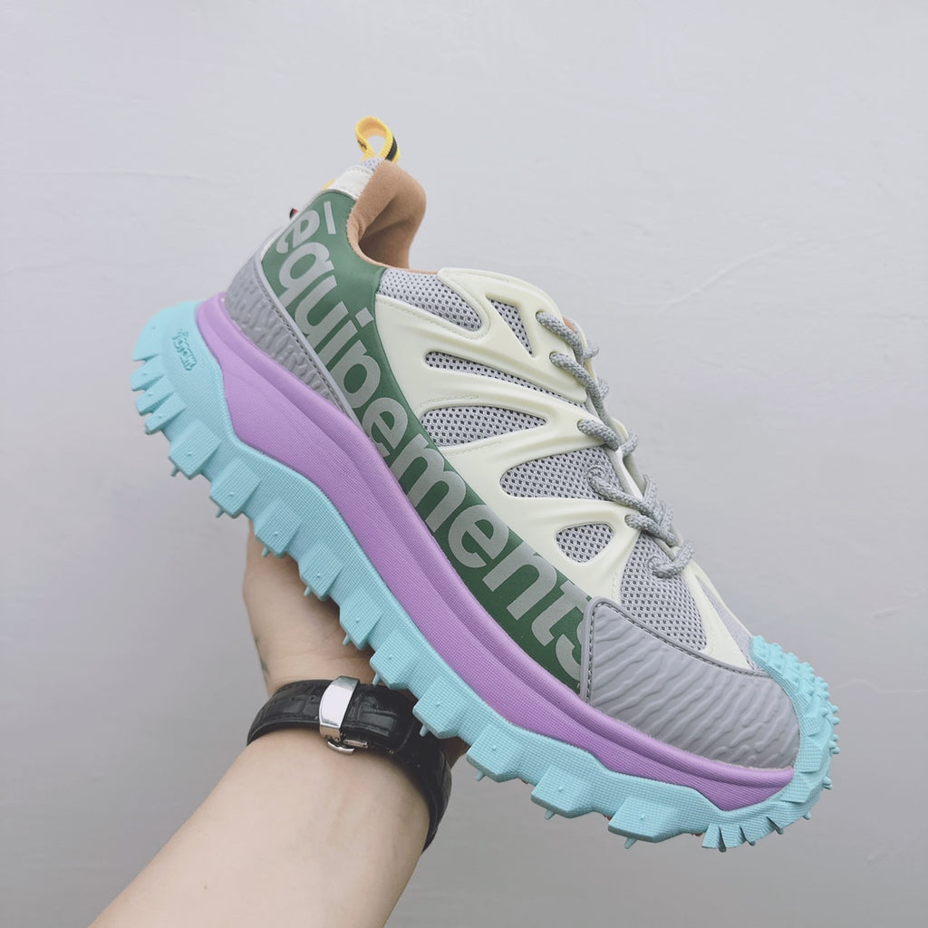 Moncler luxury sneaker, side close-up with green logo band, purple midsole, teal tread
