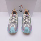 Moncler luxury sneakers, front view with white mesh upper and purple teal tread sole