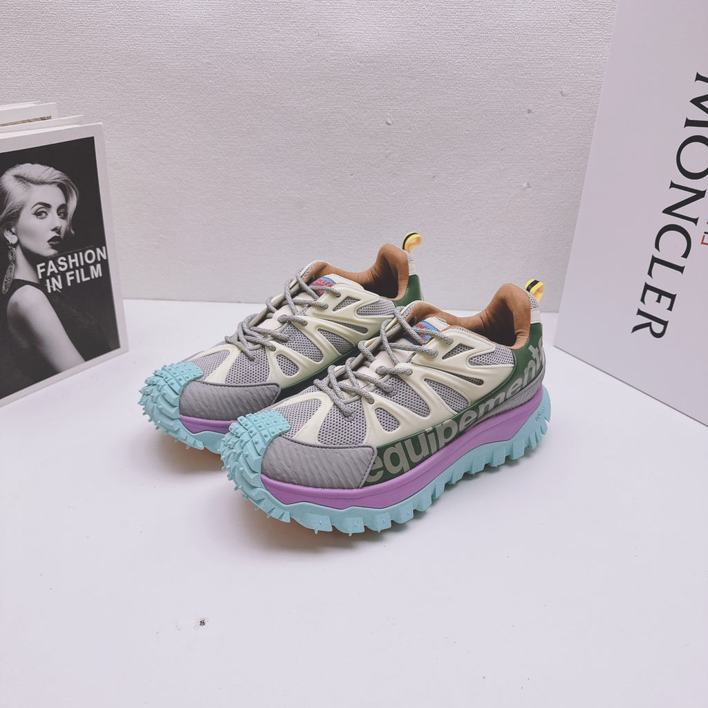 Moncler luxury sneakers pair, gray-white upper with purple and teal platform sole