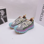 Moncler luxury sneakers pair, gray-white upper with purple and teal platform sole