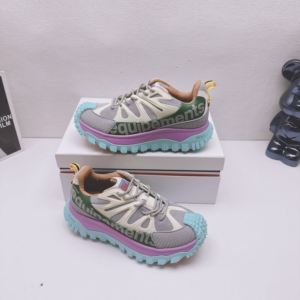 Moncler luxury sneakers on box, gray-white mesh upper with purple and teal sole