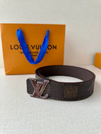 LV belt with dark monogram strap and large dark metal LV buckle