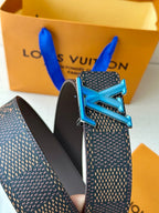 Louis Vuitton belt close-up: blue LV buckle on dark monogram strap