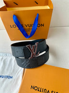 Louis Vuitton belt looped with LV buckle on dark textured strap