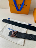 Louis Vuitton belt laid flat with LV buckle and perforated adjustment holes