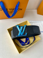 Louis Vuitton belt with dark textured strap and oversized blue LV buckle on yellow box.