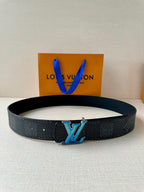 Louis Vuitton belt in dark textured leather with blue LV buckle and prong holes.