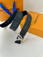 Dark textured belt with silver buckle and punched leather strap