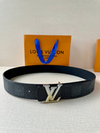 Dark textured Louis Vuitton belt with silver-tone LV logo buckle and pin holes