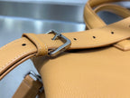 Tan leather shoulder strap with metal buckle and Dior logo