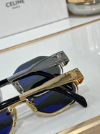 Celine sunglasses detail view: gold and silver temples with logo, blue-tinted lenses
