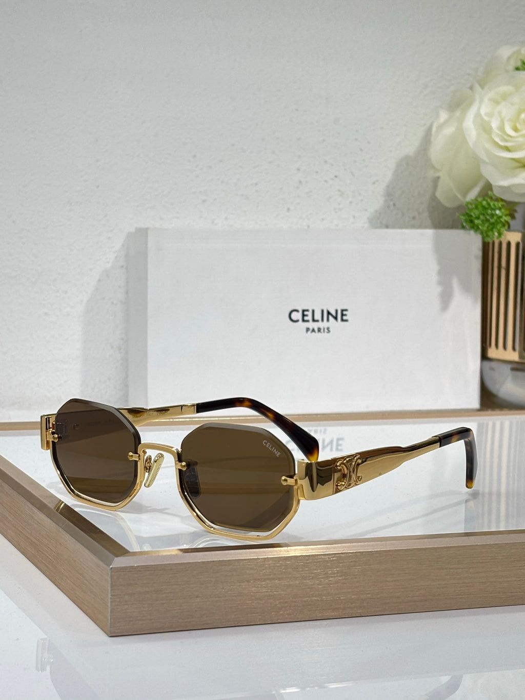 Celine sunglasses with gold-tone frames and dark brown lenses